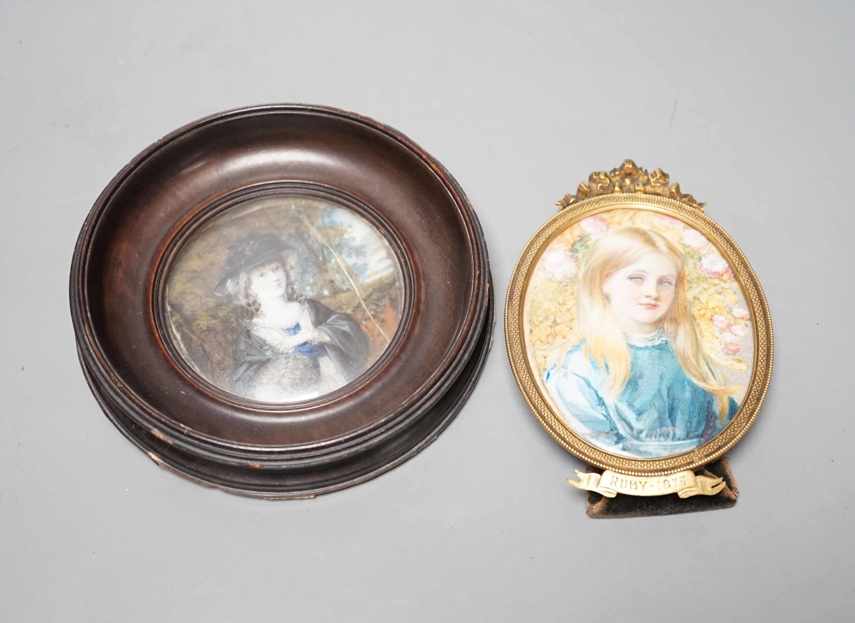 A late 19th century portrait miniature on ivory of a girl, ‘Ruby, 1875’, together with another (2)